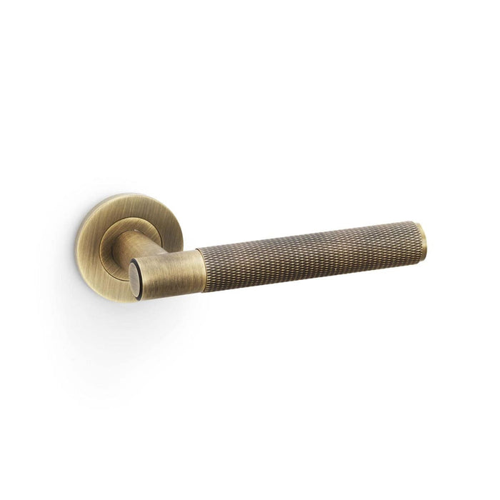 Alexander & Wilks Handles Antique Brass AW - Spitfire Knurled Lever on Round Rose